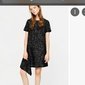 A flattering, chic dress. Darkest navy black.Great with a high platform heel.